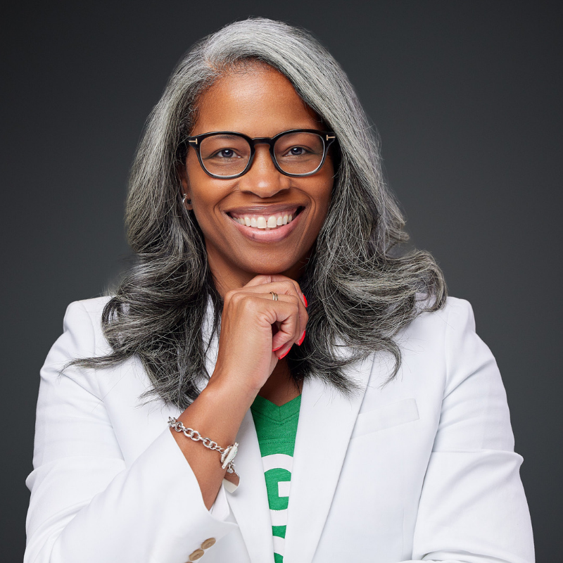 Picture of Kashundra Foreman, founder of Sugar Mode Off in green shirt and white jacket.